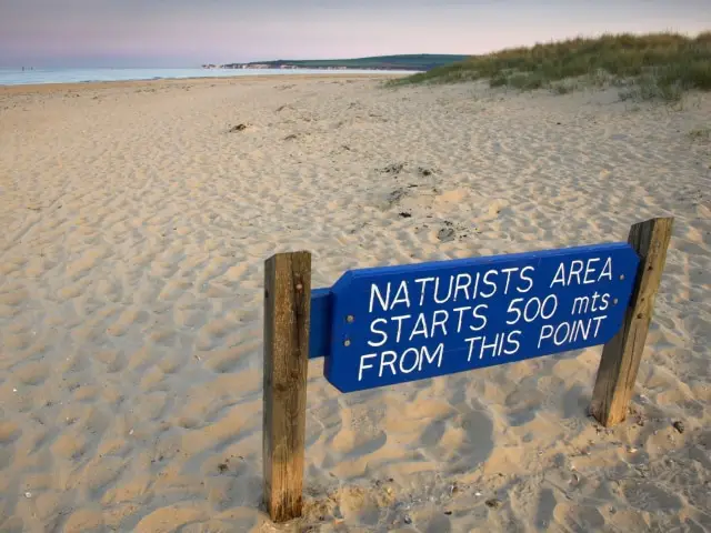Nudist beach sign